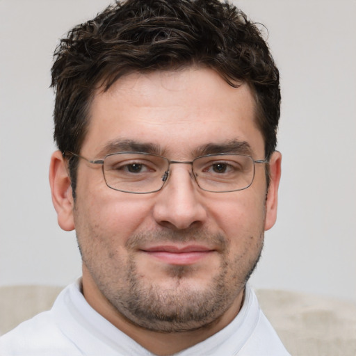 Joyful white adult male with short  brown hair and brown eyes