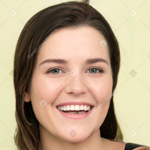 Joyful white young-adult female with long  brown hair and green eyes