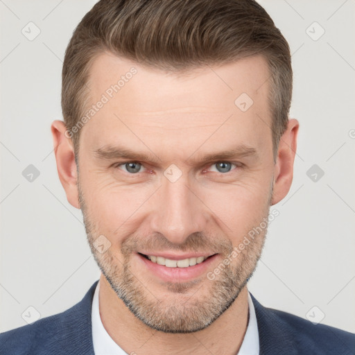 Joyful white adult male with short  brown hair and brown eyes