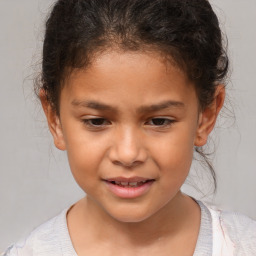 Joyful white child female with short  brown hair and brown eyes