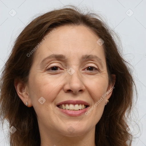 Joyful white adult female with long  brown hair and brown eyes