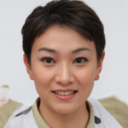 Joyful asian young-adult female with short  brown hair and brown eyes