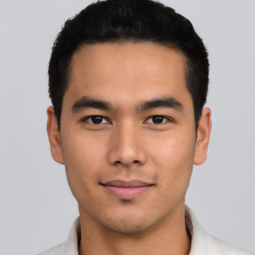 Joyful asian young-adult male with short  black hair and brown eyes