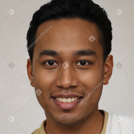 Joyful black young-adult male with short  black hair and brown eyes