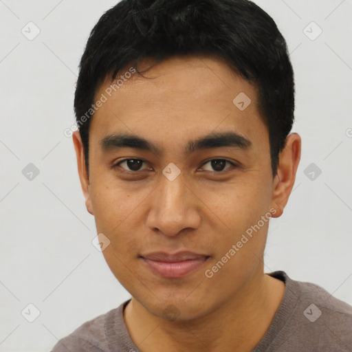 Joyful asian young-adult male with short  black hair and brown eyes