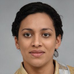 Joyful latino young-adult female with short  brown hair and brown eyes