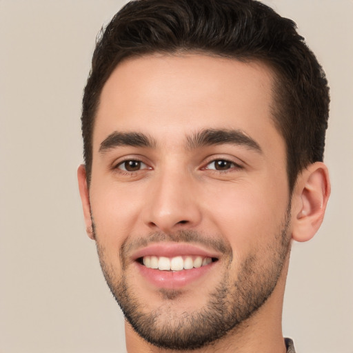 Joyful white young-adult male with short  brown hair and brown eyes