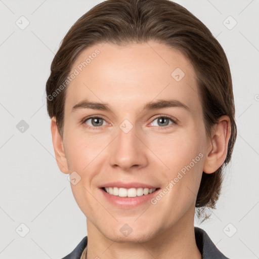 Joyful white young-adult female with medium  brown hair and grey eyes