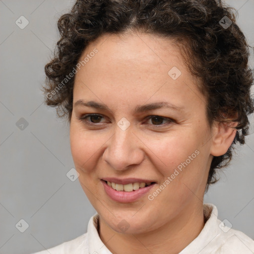 Joyful white adult female with short  brown hair and brown eyes