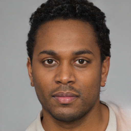 Neutral black young-adult male with short  black hair and brown eyes