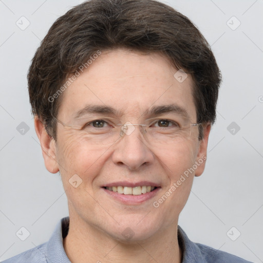 Joyful white adult male with short  brown hair and grey eyes