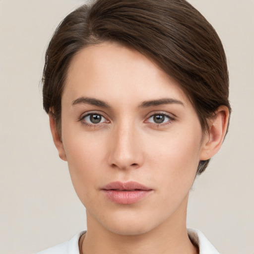 Neutral white young-adult female with short  brown hair and brown eyes