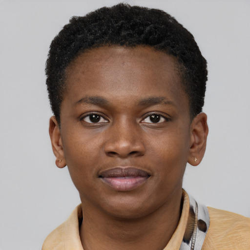 Joyful black young-adult male with short  brown hair and brown eyes