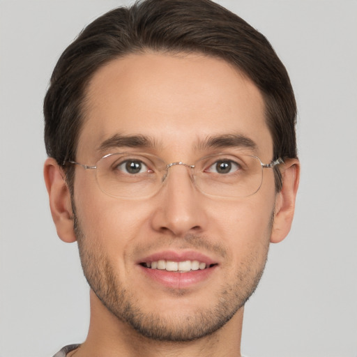 Joyful white young-adult male with short  brown hair and brown eyes