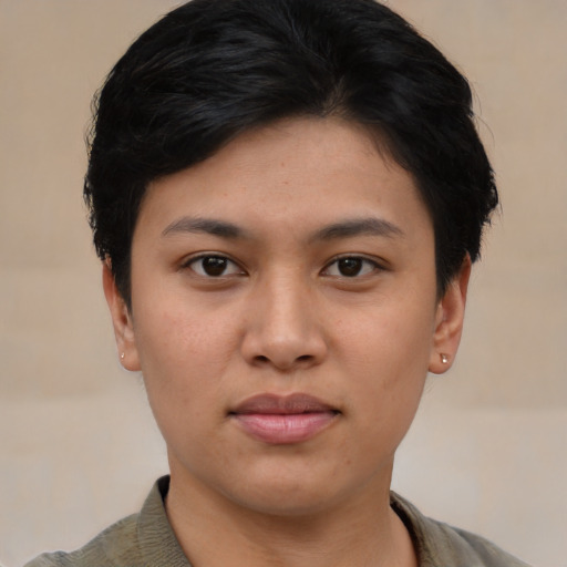 Joyful asian young-adult female with short  black hair and brown eyes