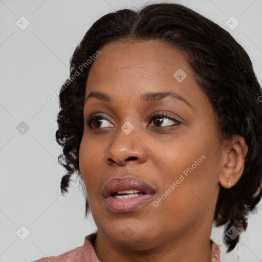 Joyful black young-adult female with medium  brown hair and brown eyes