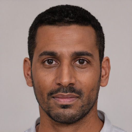 Neutral black young-adult male with short  black hair and brown eyes