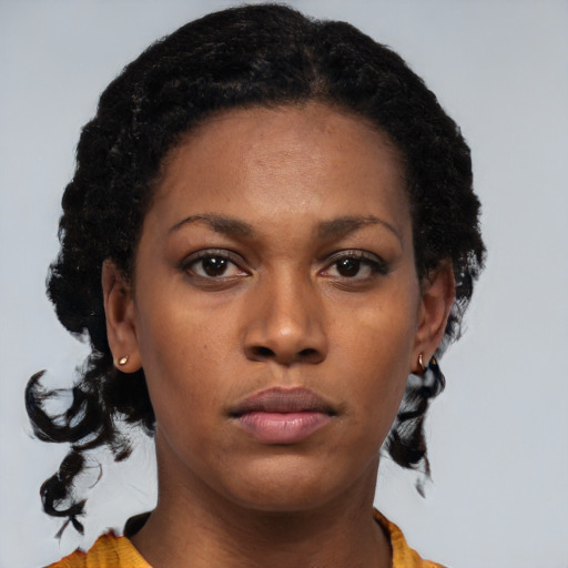 Neutral black young-adult female with medium  black hair and brown eyes