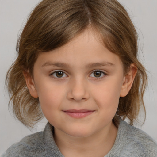 Joyful white child female with medium  brown hair and grey eyes