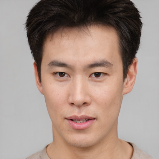 Neutral asian young-adult male with short  brown hair and brown eyes