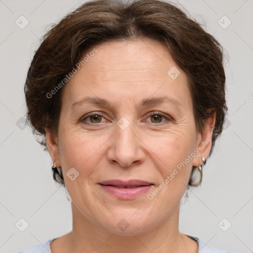 Joyful white adult female with short  brown hair and brown eyes