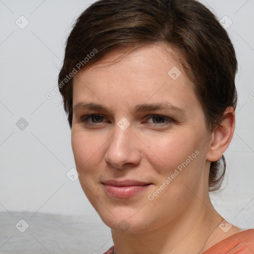 Joyful white young-adult female with medium  brown hair and blue eyes