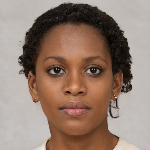Neutral black young-adult female with short  brown hair and brown eyes