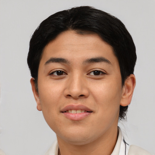 Joyful asian young-adult female with short  black hair and brown eyes