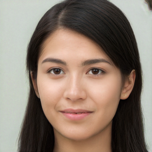 Joyful asian young-adult female with long  brown hair and brown eyes