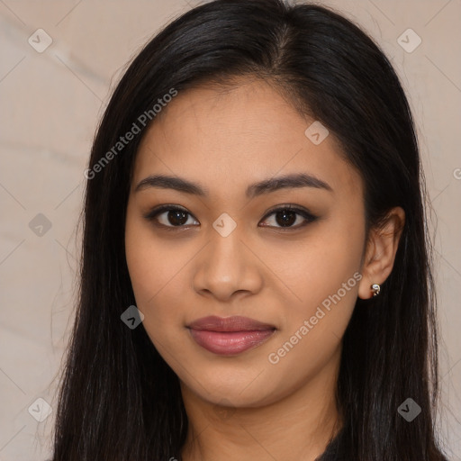 Joyful latino young-adult female with long  brown hair and brown eyes