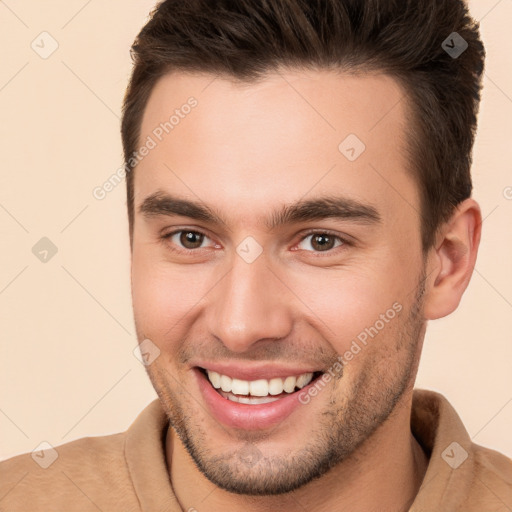 Joyful white young-adult male with short  brown hair and brown eyes