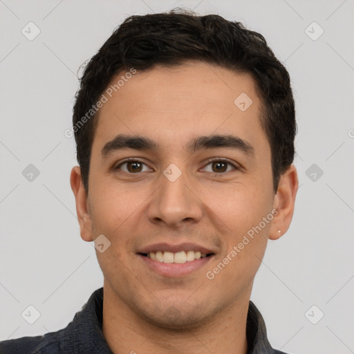 Joyful white young-adult male with short  black hair and brown eyes