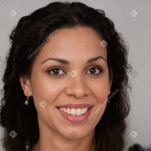 Joyful black young-adult female with long  brown hair and brown eyes