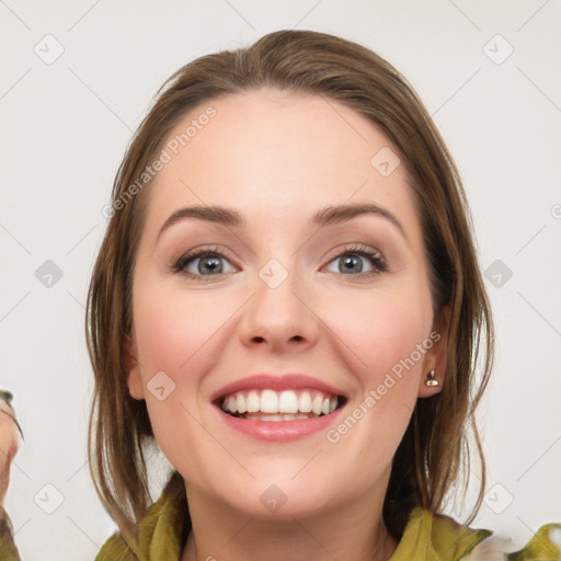 Joyful white young-adult female with medium  brown hair and green eyes