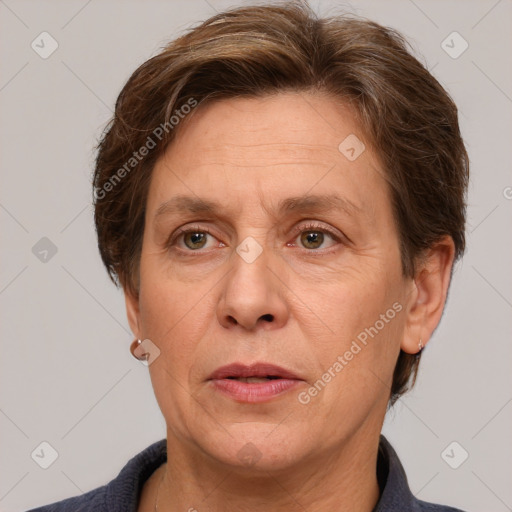 Joyful white adult female with short  brown hair and grey eyes