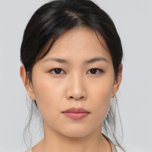 Neutral asian young-adult female with medium  brown hair and brown eyes