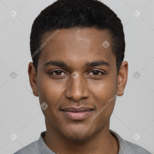 Joyful black young-adult male with short  black hair and brown eyes