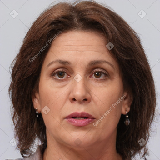 Joyful white adult female with medium  brown hair and brown eyes