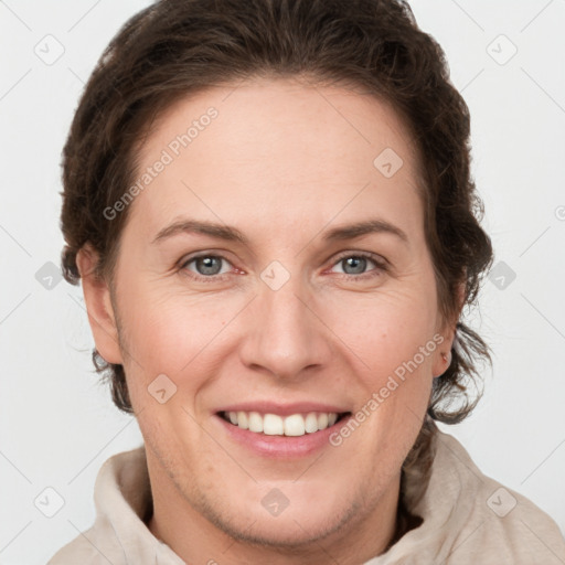 Joyful white adult female with short  brown hair and grey eyes