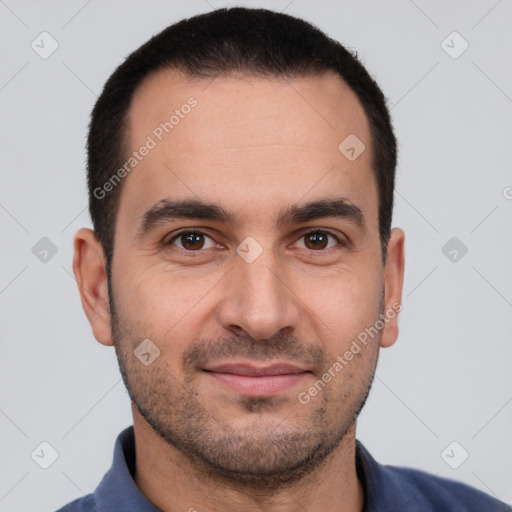 Joyful white young-adult male with short  black hair and brown eyes