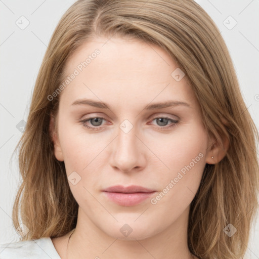 Joyful white young-adult female with long  brown hair and blue eyes