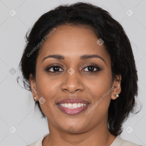 Joyful black young-adult female with medium  brown hair and brown eyes