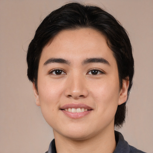 Joyful white young-adult female with medium  black hair and brown eyes