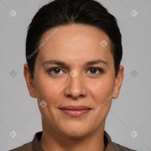 Joyful white adult female with short  brown hair and grey eyes