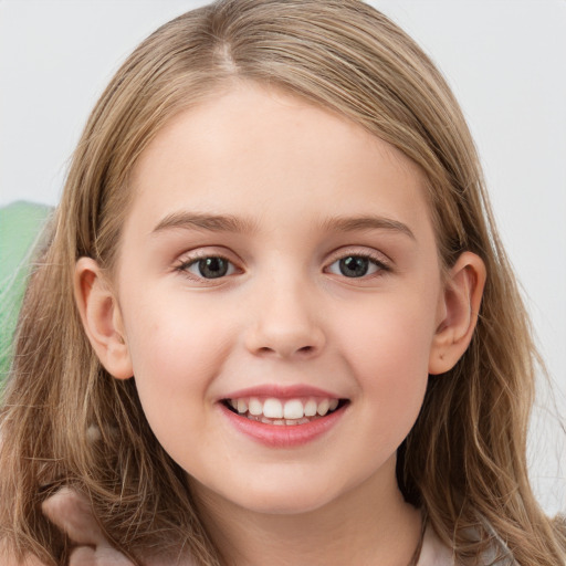 Joyful white child female with long  brown hair and grey eyes