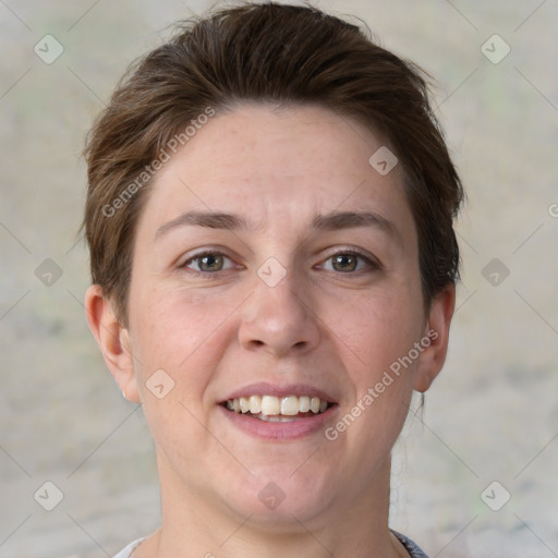 Joyful white adult female with short  brown hair and grey eyes