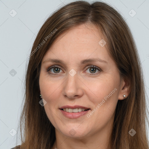 Joyful white adult female with long  brown hair and brown eyes