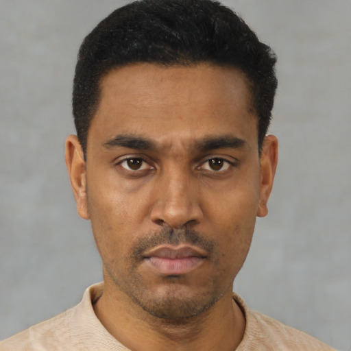 Neutral latino young-adult male with short  black hair and brown eyes