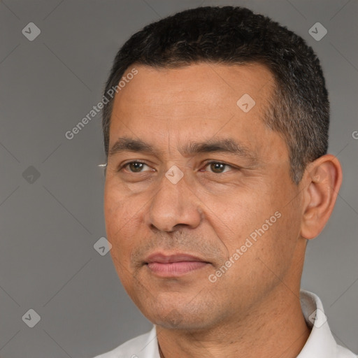 Joyful white adult male with short  black hair and brown eyes