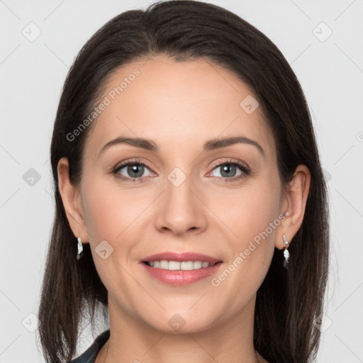 Joyful white young-adult female with long  brown hair and grey eyes